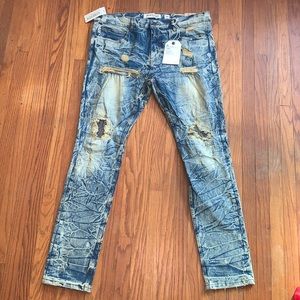 Denim destroyed jeans, completely new with tags and hasn’t been worn once.